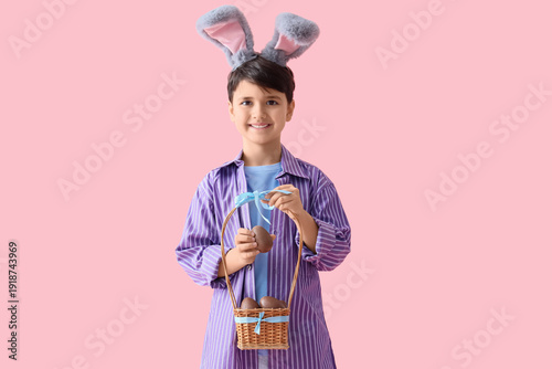 Cute boy in bunny ears hold...
