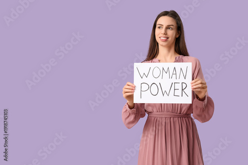 Young woman with placard on...