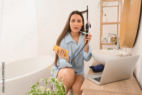 Hurrying young woman with l...
