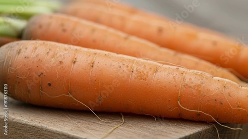 Fresh Organic Carrots on a Wooden Board Ready for Cooking.