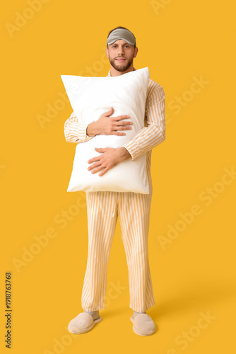 Young man in pajamas with s...