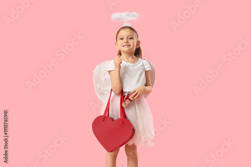 Cute little girl dressed as...