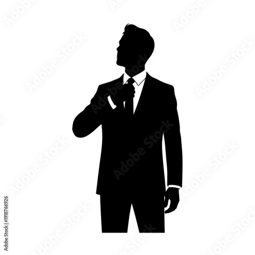 Silhouette of a Man in Suit Adjusting Tie.
