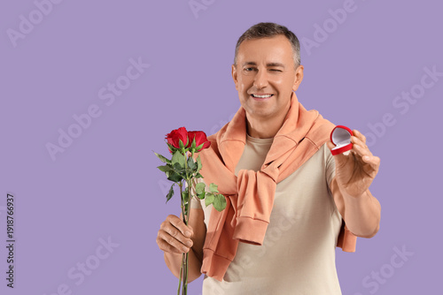 Happy mature man with rose ...