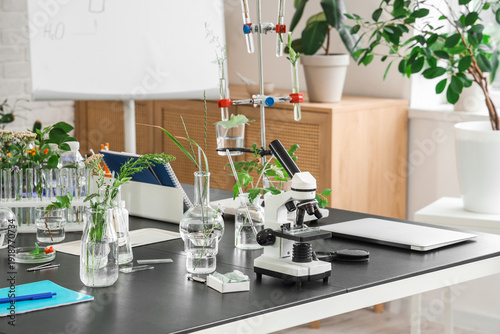 Microscope and flasks with ...