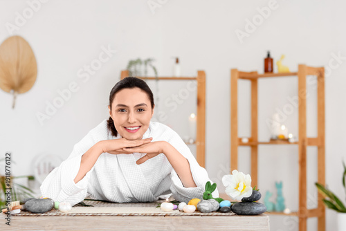 Young woman relaxing in spa...