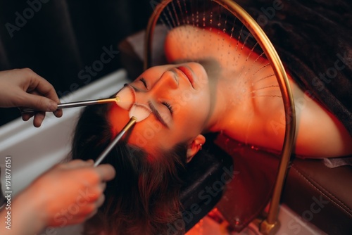 Woman enjoying head spa scalp treatment and massage