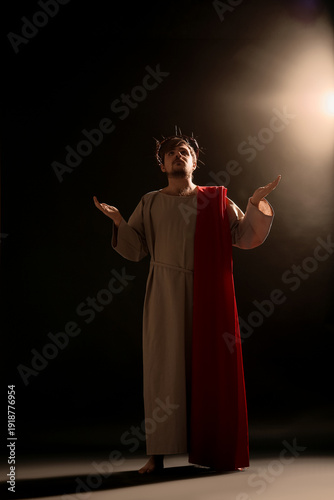 Man in Jesus robe and crown...