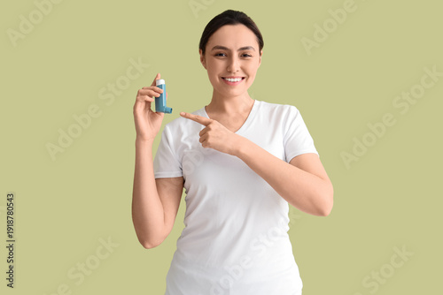 Sporty young woman pointing...