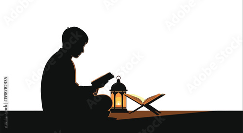 Silhouette of a boy reading a holy book by glowing lantern light at.