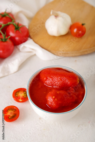 Bowl of canned tomatoes and...