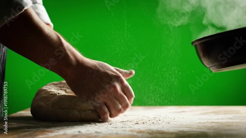 Hands kneading dough on a wooden surface with steam rising from a pot, a culinary preparation