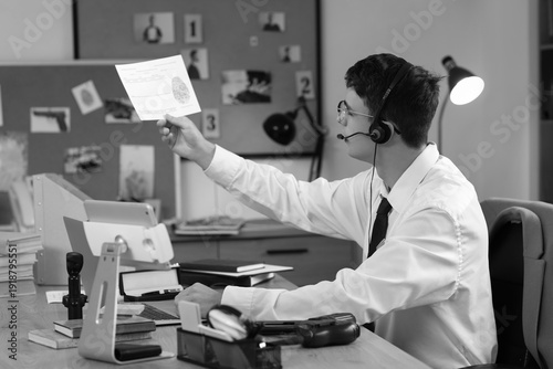 Male FBI agent studying fin...