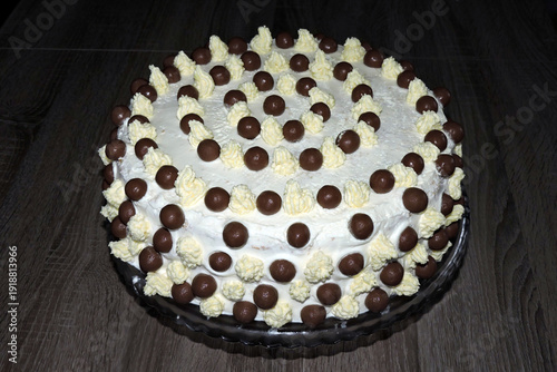 Wallpaper Mural A minimalist homemade white birthday cake with chocolate balls and buttercream peaks, isometric view Torontodigital.ca