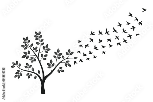 A silhouetted tree branch with numerous birds taking flight in a curved pattern