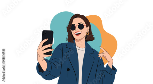 Stylish young woman wearing sunglasses and a navy blue coat taking a selfie with a smartphone against colorful abstract shapes background.