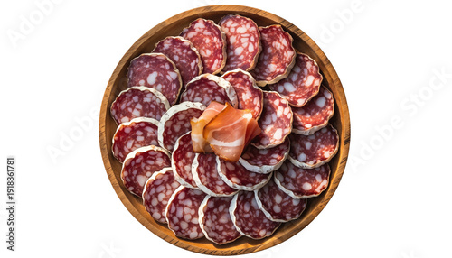Circular wooden platter with sliced cured meats arranged neatly