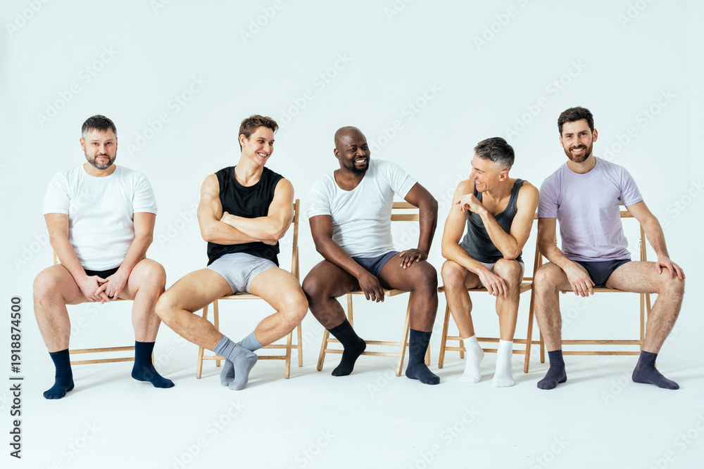 Obraz premium group of multiethnic men posing for a male edition body positive beauty set. Shirtless guys with different age, and body wearing boxers underwear