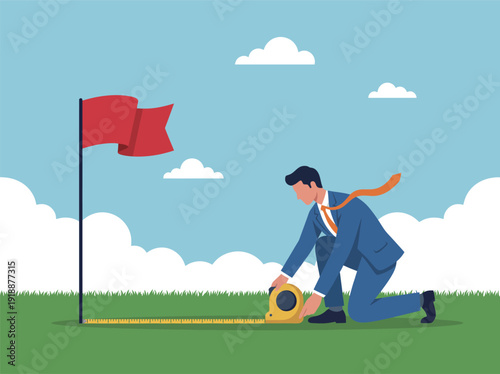 A professional man kneels using a tape measure to assess distance while a red flag indicates a goal in the background, symbolizing determination and success.