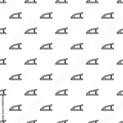 Staple remover tools creating a seamless pattern on a white background