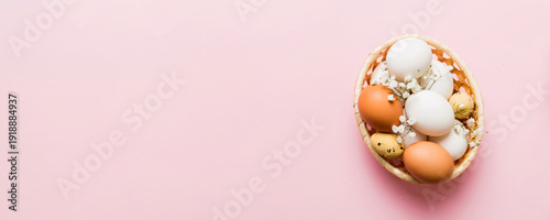 Wallpaper Mural Happy Easter composition. Easter eggs in basket on colored table with gypsophila. Natural dyed colorful eggs background top view with copy space Torontodigital.ca