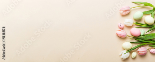 Wallpaper Mural Happy Easter composition. Easter eggs on colored table with yellow Tulips. Natural dyed colorful eggs background top view with copy space Torontodigital.ca