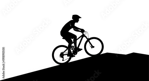 Mountain Biker Riding Downhill Silhouette.