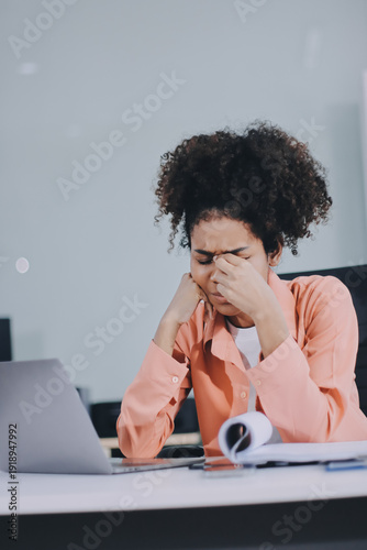 Businesswoman get stressed and headache while having a problem at work in office