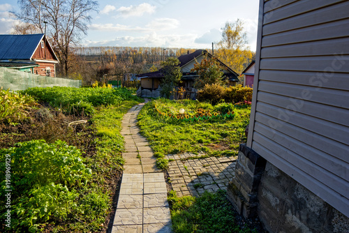 old wooden house in the village in autumn
