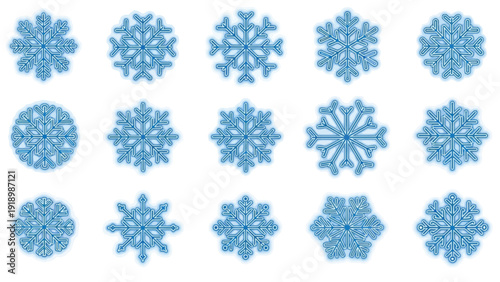 Collection of various blue snowflakes on a white background in a flat lay composition with a winter wonderland feel.