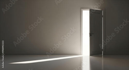 Tableau sur toile Open doorway casting a bright light beam across a dark room floor and wall