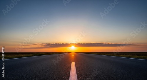 Photos Empty asphalt road stretching towards the horizon under a vibrant sunset sky