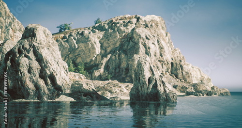 Quadro su tela Rocky cliff formations rise dramatically from the tranquil water as gentle waves lap against the shore