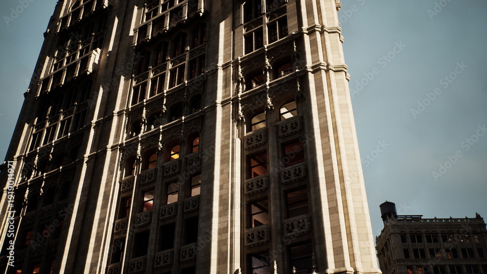 Αυτοκόλλητο Sunlit masonry skyscraper with details showcasing neoclassical pilasters and dec
