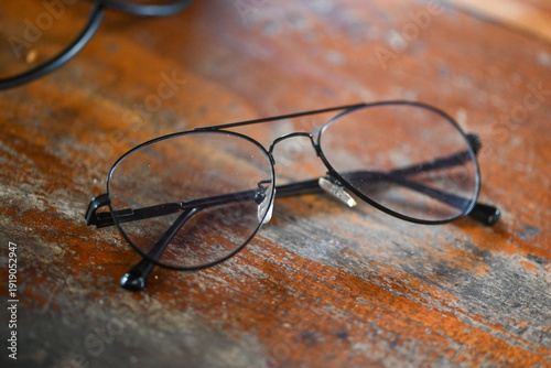 Aviator eyeglasses on wooden table
