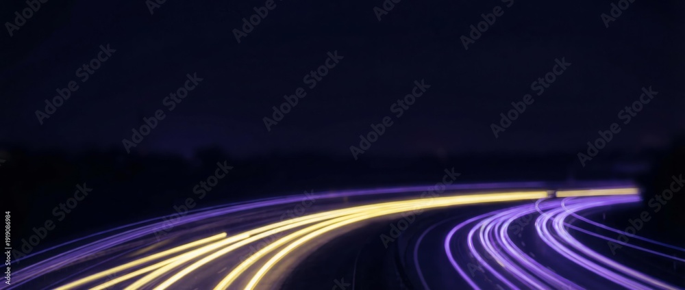 Fototapeta premium Long-exposure motion blur of neon city lights, with vibrant yellow and magenta streaks, capturing dynamic urban energy for web banners, modern branding, and digital design.