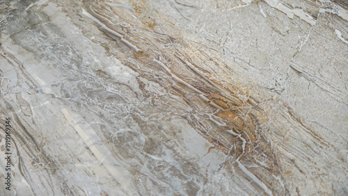 Wallpaper Mural Elegant and organic natural stone surface with swirling abstract patterns, showcasing earthy tones of beige, grey, and brown, ideal for luxury interior design backgrounds or decorative textures Torontodigital.ca