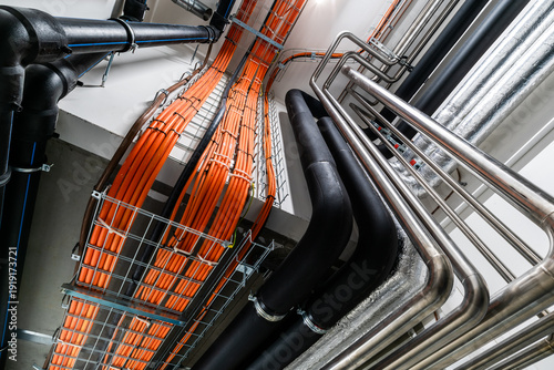 Bild auf Leinwand Industrial cable trays with organized electrical wiring installation