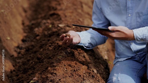 Modern farming farmer agriculture soil tablet technology field digital rural analysis male farmer using digital tablet beside soil furrow focused research innovation modern farm agriculture field