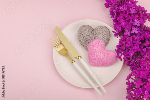 Gentle spring table setting with handmade hearts and lilac flowers.Valentine's or Mothers Day
