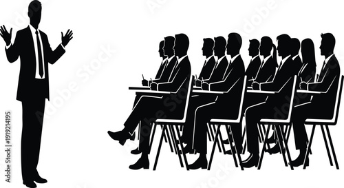 Person Speaking to a Seated Audience in a Business Setting