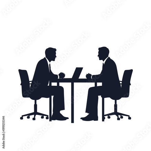 Two Businessmen Sitting at Office Desk.