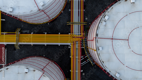 Bild auf Leinwand Aerial view white oil storage tank with pipeline steel, Crude oil industry, Storage fuel gas container tank petroleum refinery industrial factory, Oil storage chemical petrochemical refinery product