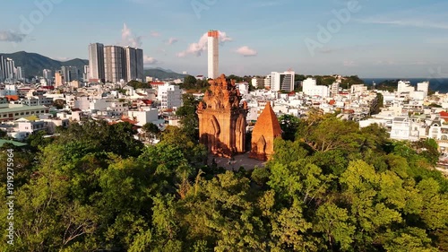 Aerial view of po nagar cham towers ancient hindu temple in nha trang, vietnam, with cityscape and coastline