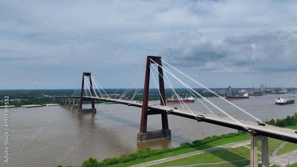 Αυτοκόλλητο Cars traveling on Hale Boggs Memorial Bridge, a cable-stayed bridge over the Mississippi River in St