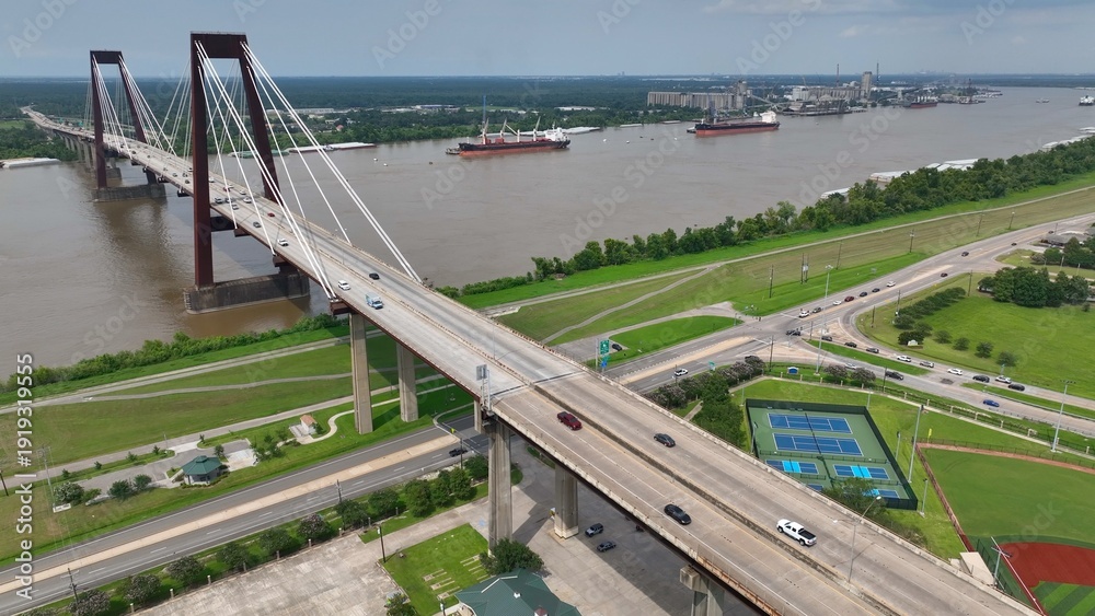Αυτοκόλλητο Cars traveling on Hale Boggs Memorial Bridge, a cable-stayed bridge over the Mississippi River in St
