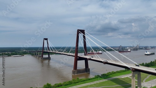 Slika na platnu Cars traveling on Hale Boggs Memorial Bridge, a cable-stayed bridge over the Mississippi River in St
