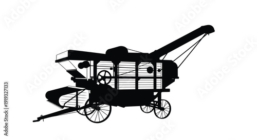 Vintage flat vector silhouette of old-fashioned stationary threshing machine with hopper and wheels isolated on white background