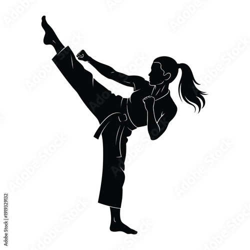 Female martial artist performing powerful kick in fighting stance

