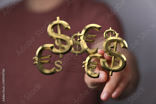 Hand holding dollar and eur...